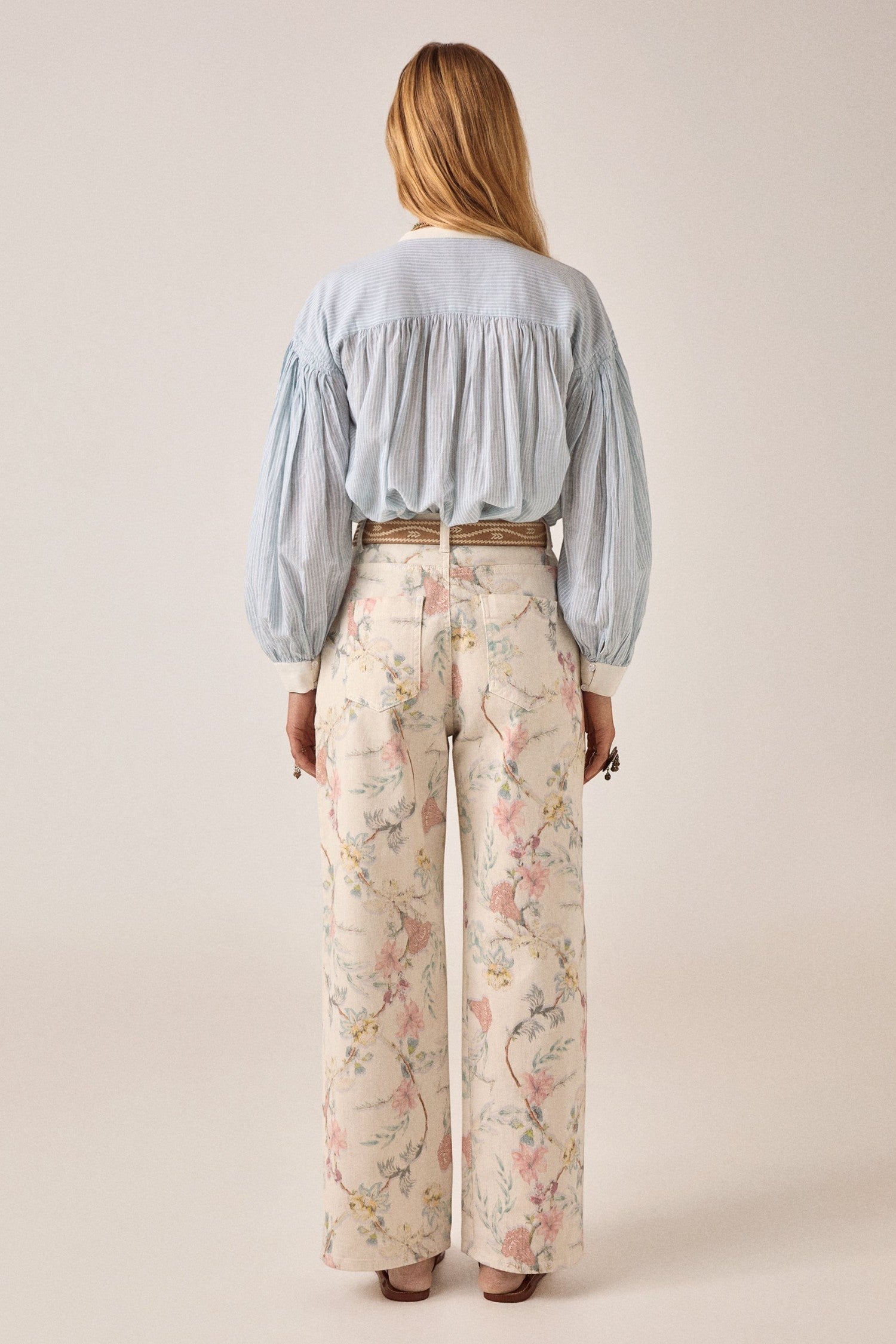 ELSHAM BOUTIQUE Bonifacio shirt in light blue pinstripe cotton with balloon sleeves worn with floral print trousers
