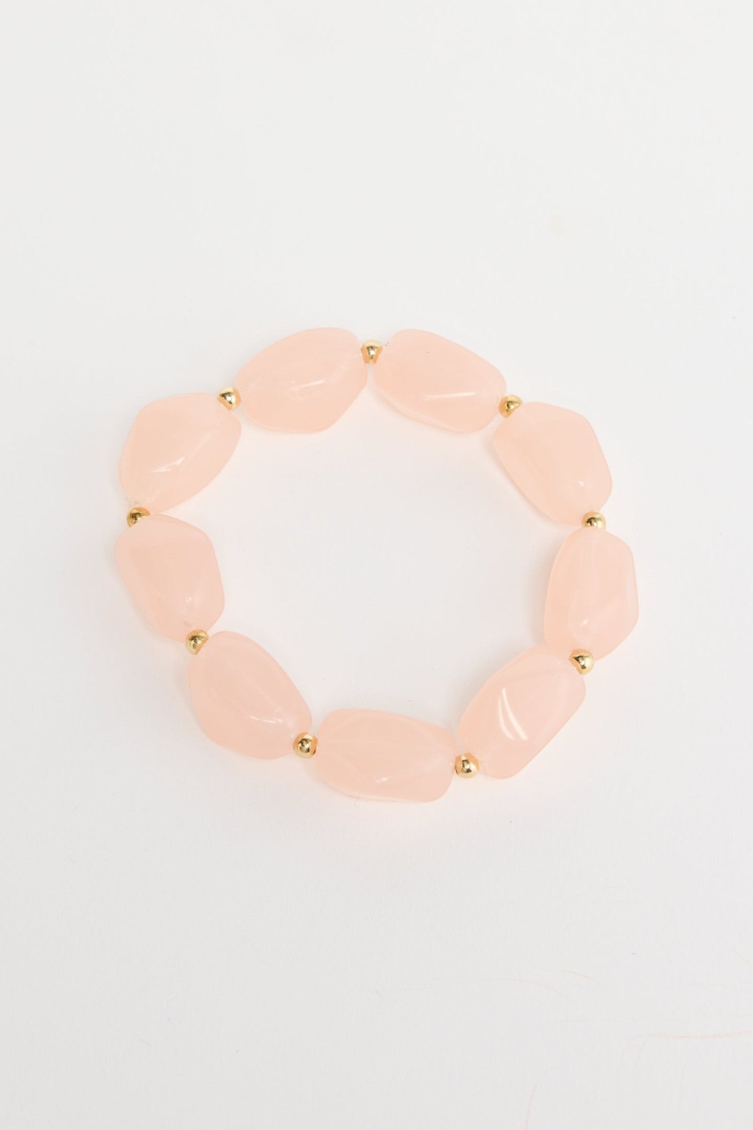 ELSHAM BOUTIQUE Havana stretch bracelet featuring blush pink resin beads and small gold-tone metal accents