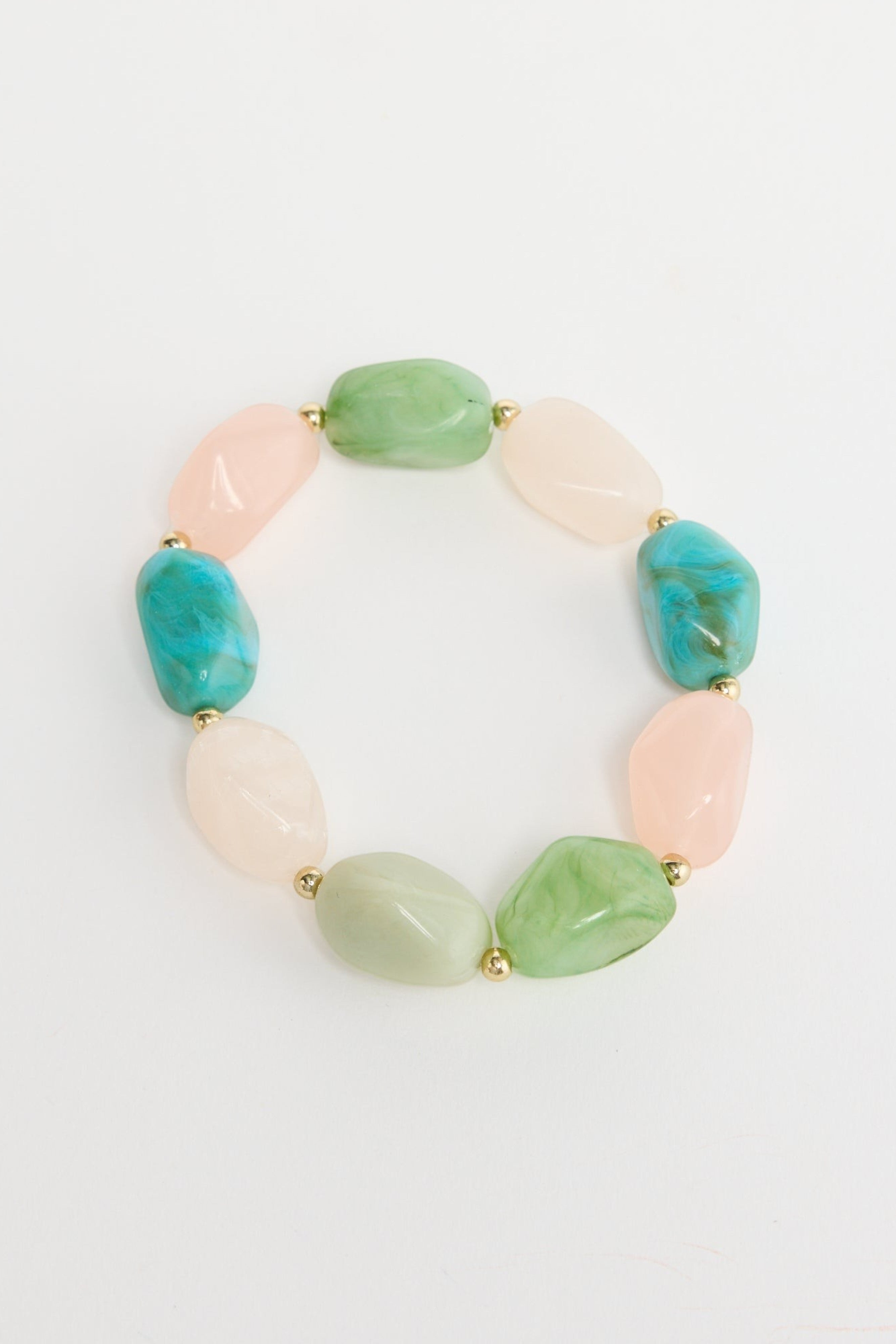 ELSHAM BOUTIQUE Havana stretch bracelet featuring multi-coloured resin beads in blush pink, green, and teal tones.