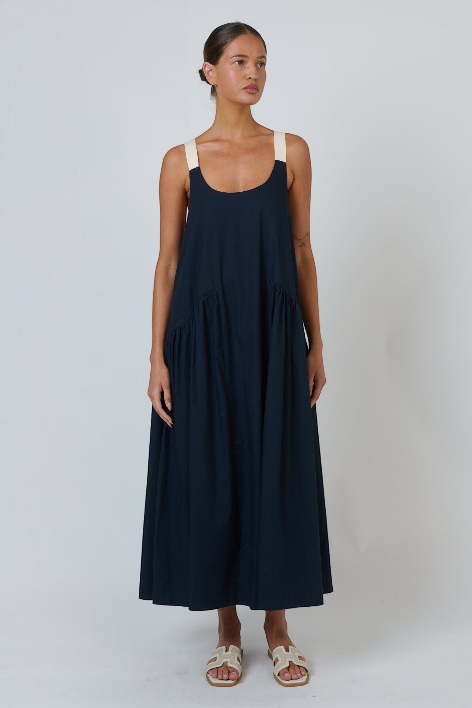 ELSHAM BOUTIQUE ink blue poplin maxi dress with scoop neckline and adjustable contrast buckle straps on a model