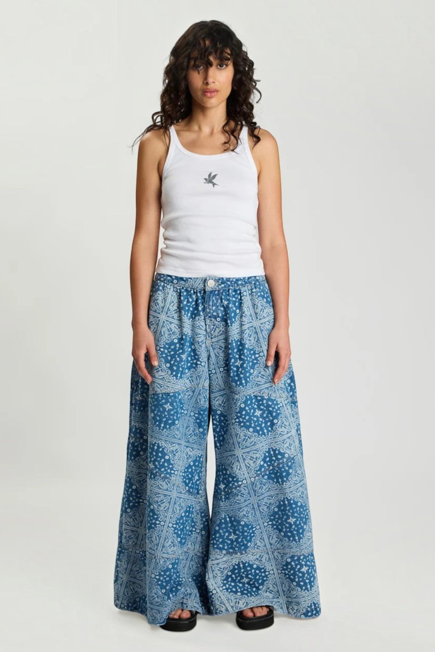 ELSHAM BOUTIQUE Daddios low waist super wide leg denim jeans in Aegean paisley blue with asymmetrical front seams.