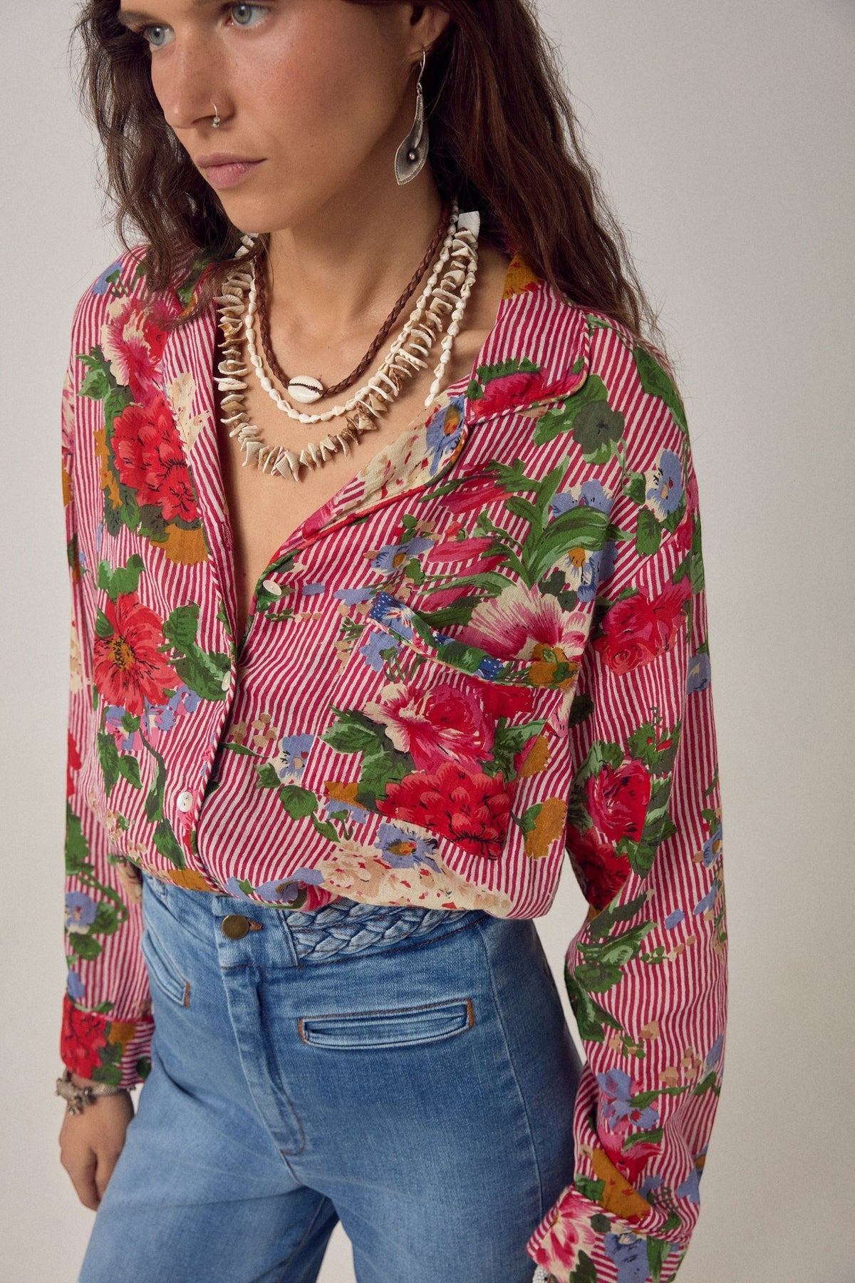 ELSHAM BOUTIQUE Piti shirt in rouge featuring a bold floral print over fine stripes, crafted from soft cotton.