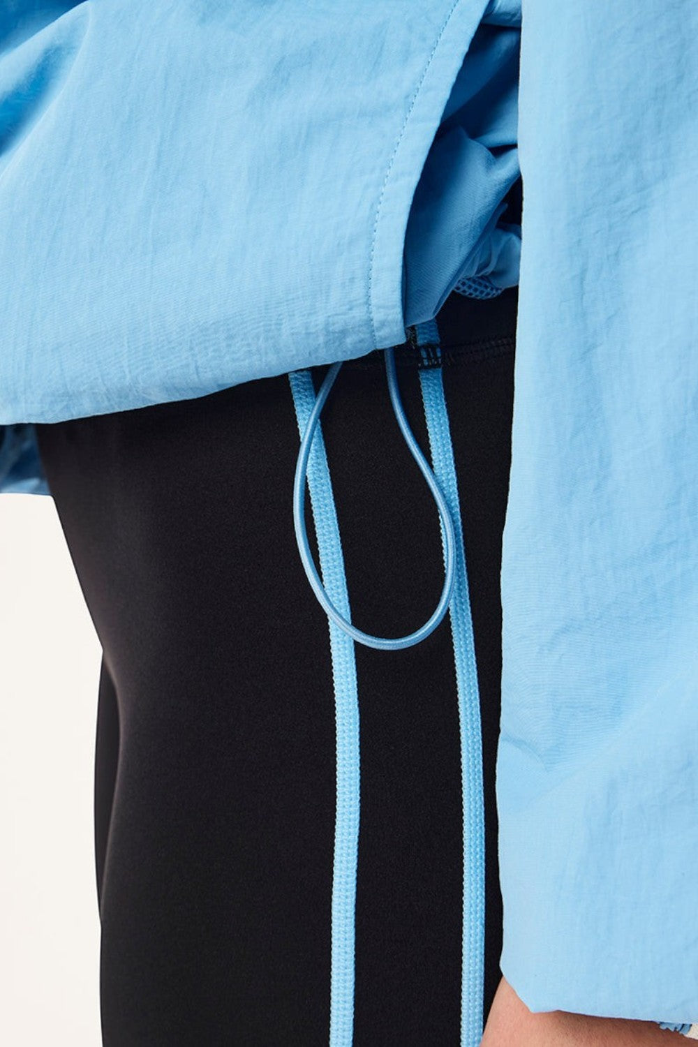 ELSHAM BOUTIQUE Radius Jacket in Alaskan Blue featuring a lightweight matte fabric and an adjustable hem drawcord.