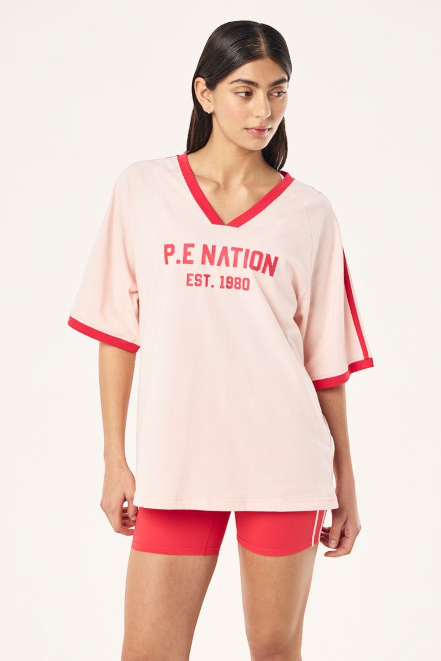 ELSHAM BOUTIQUE Spinout baseball tee in soft pink organic cotton with red contrast binding and front graphic print