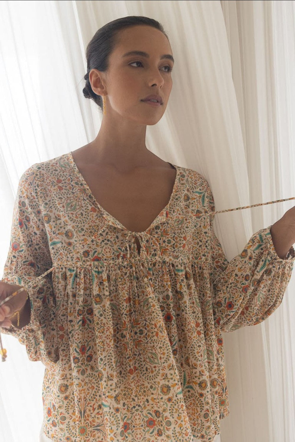 ELSHAM BOUTIQUE Yasmin midi dress in almond print with V-neckline and tiered frill details on a model