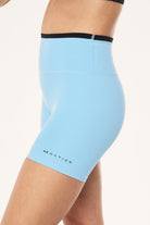 ELSHAM BOUTIQUE Stellar 5-inch high-rise bike shorts in Alaskan blue with a black contrast waistband and logo detail.