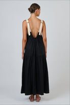 ELSHAM BOUTIQUE black poplin maxi dress with contrast buckle straps and a scoop back, shown from the rear view.