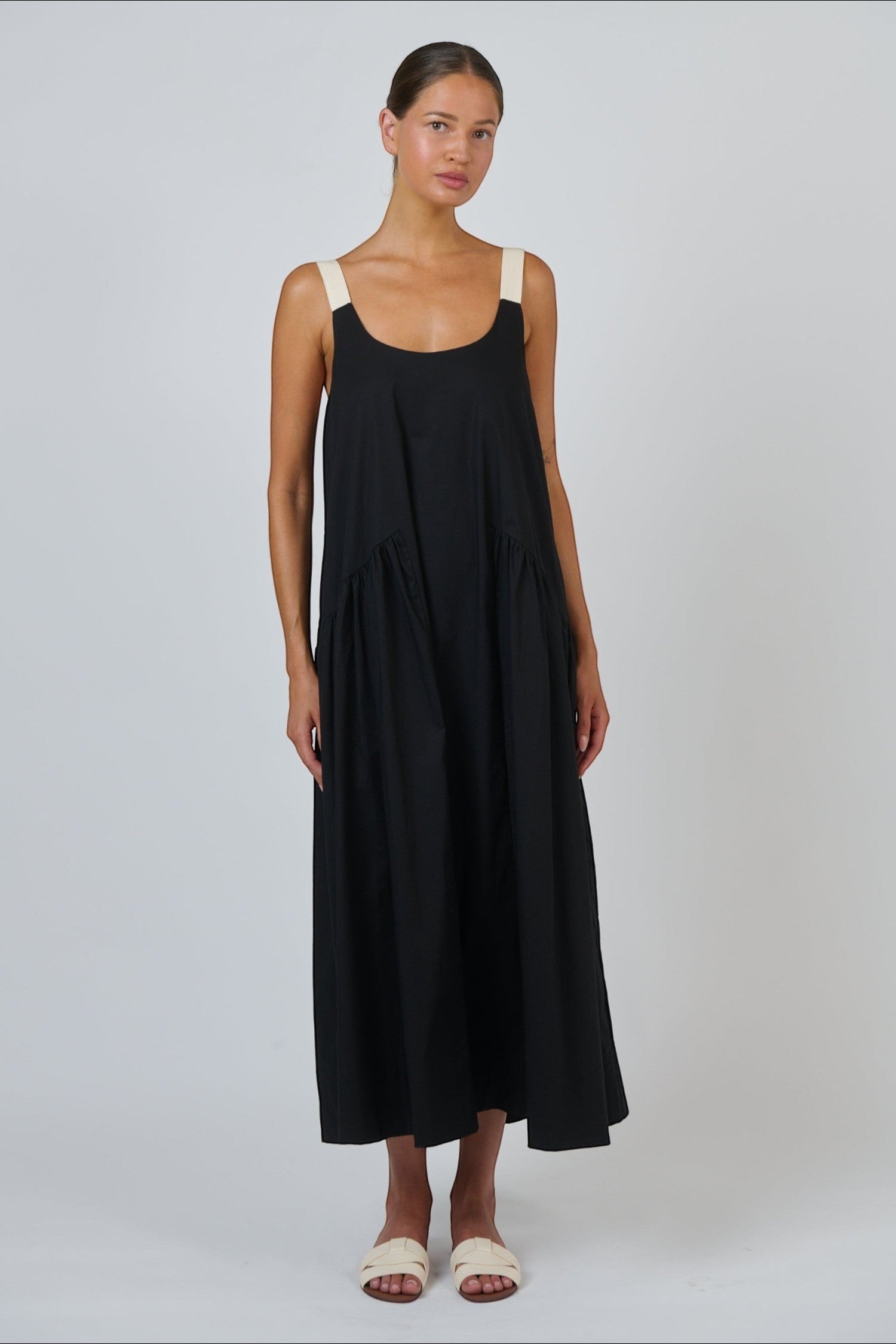 ELSHAM BOUTIQUE black poplin maxi dress with a scoop neckline and adjustable contrast straps on a model