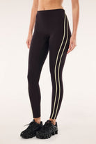 ELSHAM BOUTIQUE black bean high-rise leggings with soft yellow contrast flatlock side stripes and functional drawcord.