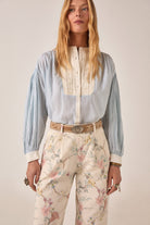ELSHAM BOUTIQUE Bonifacio shirt in light blue pinstripe cotton with cream embroidered yoke and balloon sleeves.