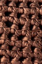 Close-up of the metallic bronze hand-crocheted texture of the ELSHAM BOUTIQUE Taylor clutch bag.