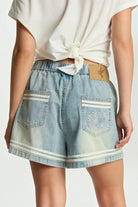 ELSHAM BOUTIQUE Funks high waist chambray blue denim shorts with elasticated waistband and floral embroidery detail.