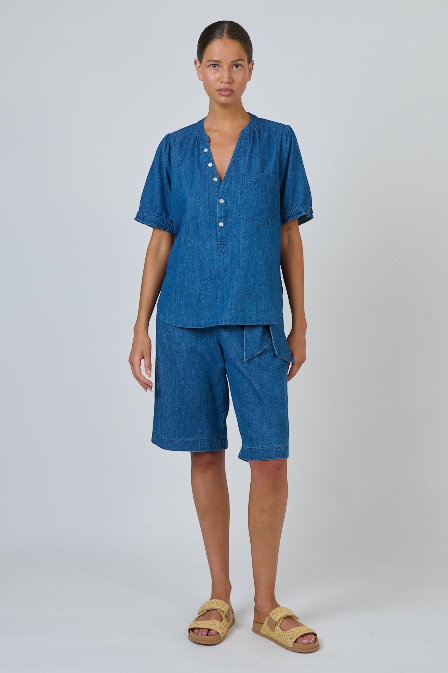 ELSHAM BOUTIQUE chambray linen blouse with V-neck, button placket, and puffed sleeves worn with matching shorts