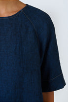 ELSHAM BOUTIQUE GA721 dark blue linen top with round neckline, elbow-length sleeves, and contrast stitching detail.