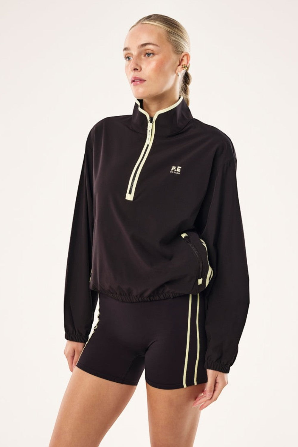 ELSHAM BOUTIQUE Echo quarter zip jacket in black bean with contrast yellow binding and adjustable waist drawcords.