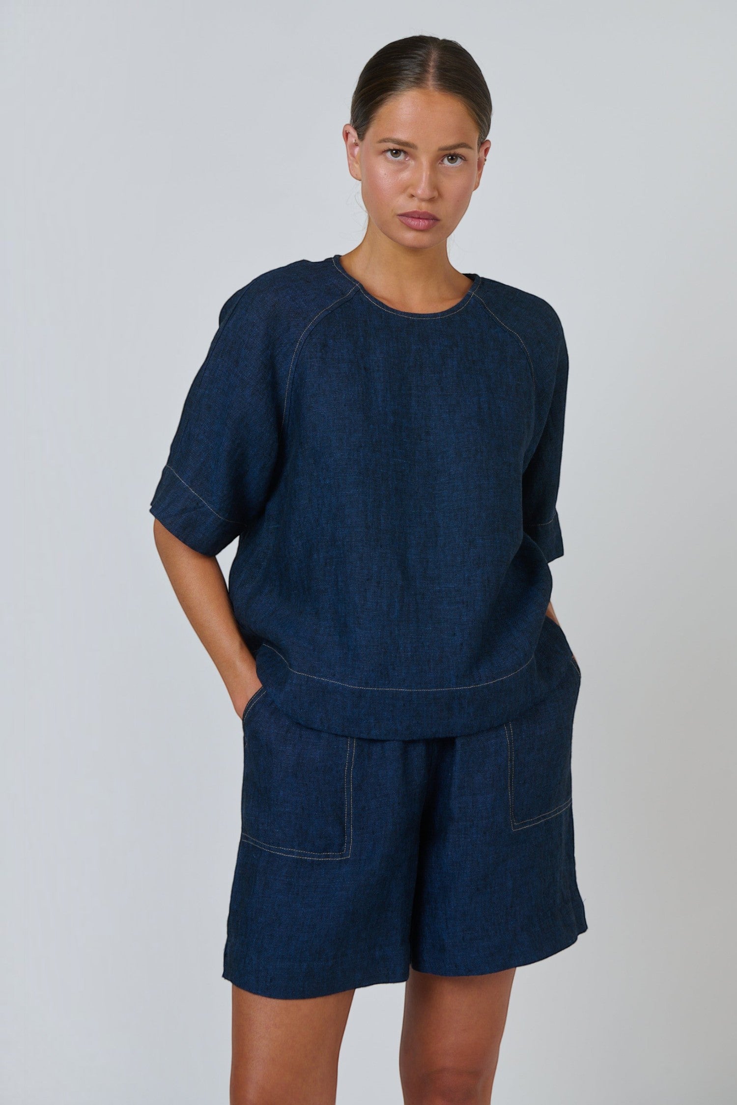 ELSHAM BOUTIQUE GA721 eclipse navy blue linen top with round neck and elbow-length sleeves on a model