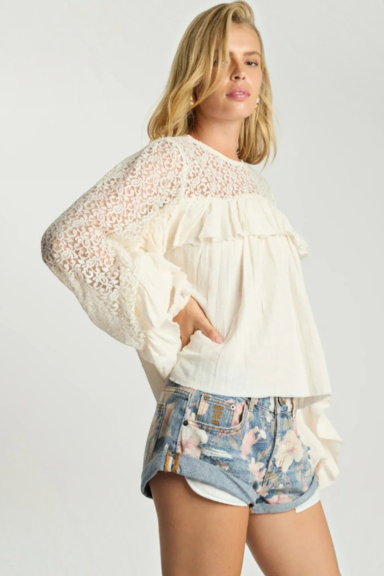 ELSHAM BOUTIQUE low waist denim shorts in Cobaine Blue with floral print, rolled hem, and distressed detailing