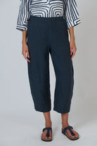 ELSHAM BOUTIQUE gunsmoke grey cropped linen tapered pants with elasticated waistband and side pockets on a model