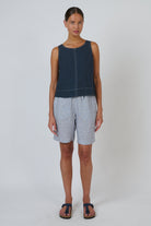 ELSHAM BOUTIQUE GA716 sleeveless linen top in gunsmoke with round neck and back button detail on a model