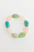 ELSHAM BOUTIQUE Havana stretch bracelet featuring multi-coloured resin beads in blush pink, green, and teal tones.