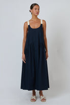 ELSHAM BOUTIQUE ink blue poplin maxi dress with scoop neckline and adjustable contrast buckle straps on a model