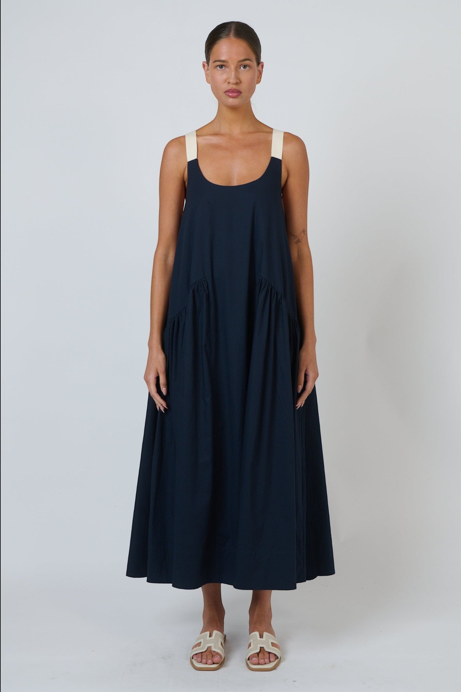 ELSHAM BOUTIQUE ink blue poplin maxi dress with a scoop neckline and contrasting adjustable buckle shoulder straps.