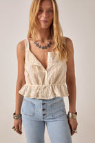 ELSHAM BOUTIQUE ivory cotton Constanza top with lace panel, V-neck, thin straps, and drawstring waist on a model.