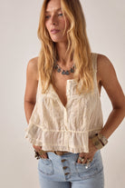 ELSHAM BOUTIQUE ivory cotton cropped top with delicate lace front panel, thin straps, and drawstring waist detail.