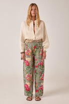 ELSHAM BOUTIQUE ivory cotton-linen blouse with delicate embroidery, long sleeves, and button-down front on a model.