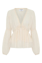 ELSHAM BOUTIQUE ivory sheer chiffon blouse with deep V-neck, lace trim, self-tie front, and voluminous peasant sleeves.
