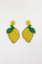 ELSHAM BOUTIQUE hand-beaded lemon statement earrings with vibrant yellow glass beads and green leaf detail.