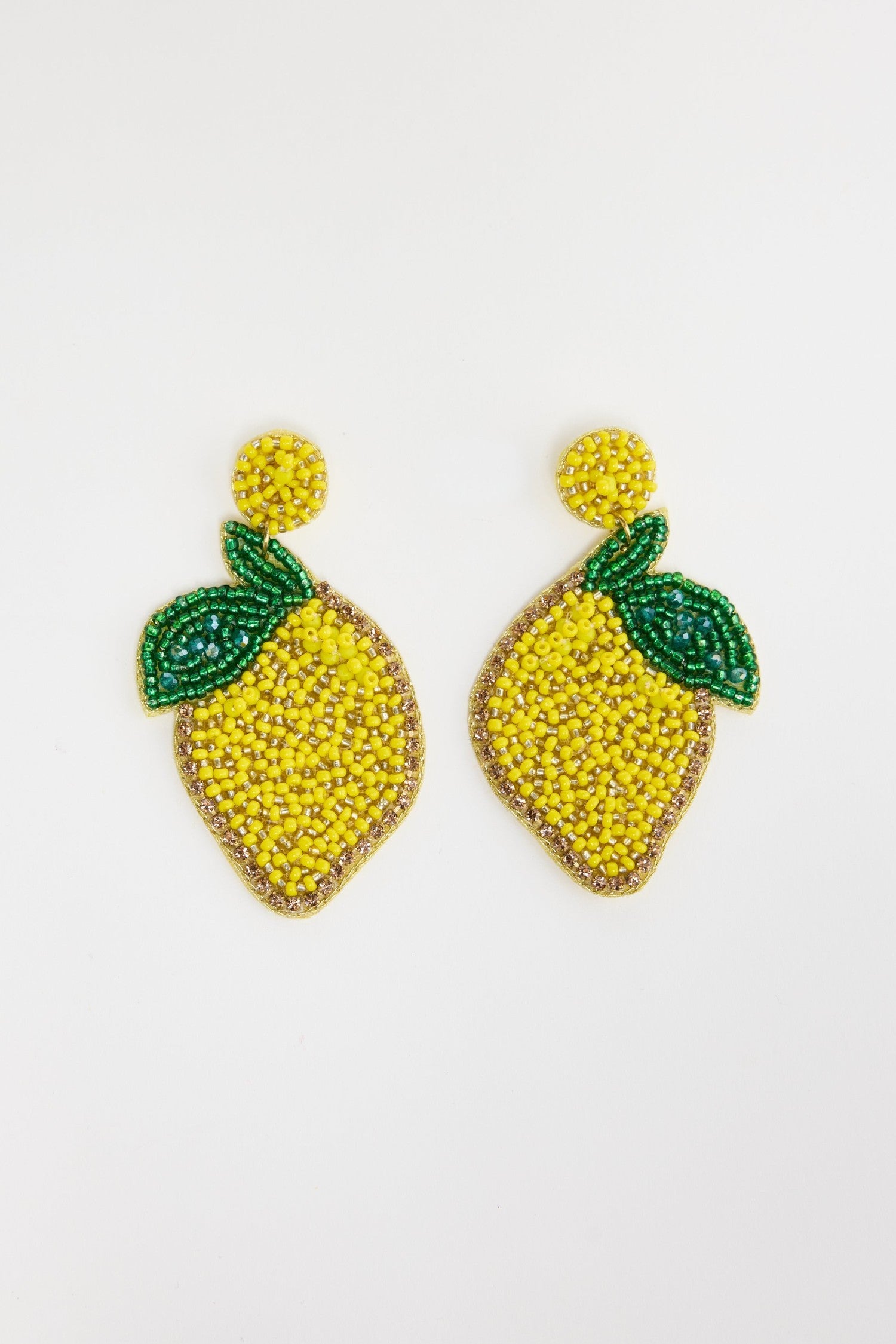 ELSHAM BOUTIQUE hand-beaded lemon statement earrings with vibrant yellow glass beads and green leaf detail.