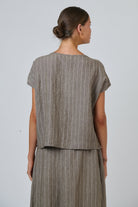 ELSHAM BOUTIQUE GA504 linen button down top in taupe with white vertical stripes, shown from the back on a model.