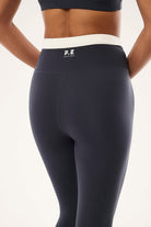 ELSHAM BOUTIQUE marine blue high-rise full length leggings with a white waistband and logo detail on the back.