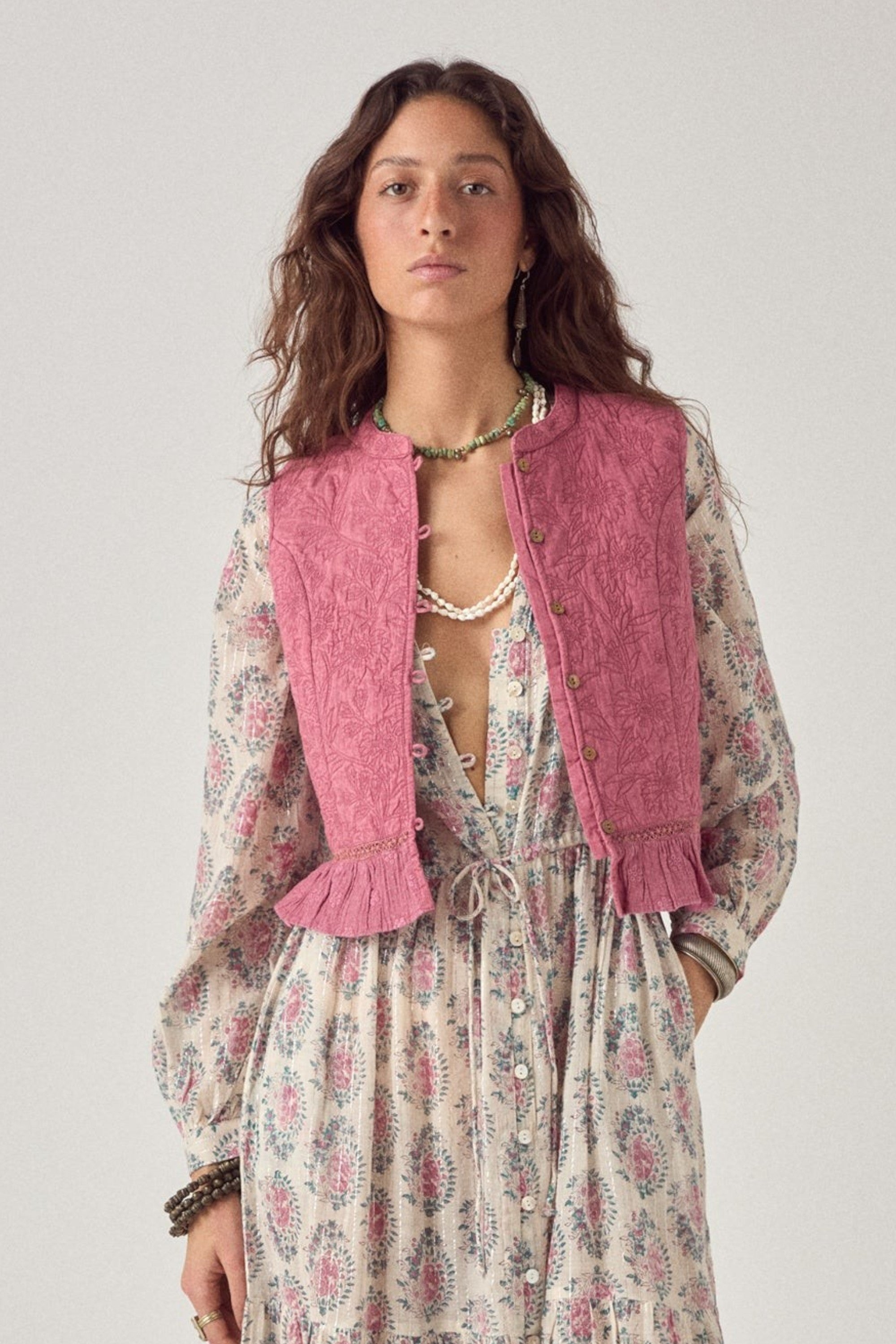 ELSHAM BOUTIQUE Mia quilted cotton vest in peonia punk pink worn over a floral maxi dress by a female model