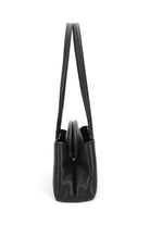 ELSHAM BOUTIQUE Mini Vault Tote in black ironed calf nappa leather with brass hardware, side view showing handles.