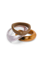 ELSHAM BOUTIQUE Nigela bangle set featuring three stacked resin bracelets in bold and neutral tones.