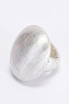 ELSHAM BOUTIQUE Nola ring in silver with a smooth domed face and brushed texture finish. Modern sculptural design.