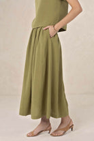ELSHAM BOUTIQUE olive midi skirt in a linen-tencel blend with an A-line silhouette and functional side pockets