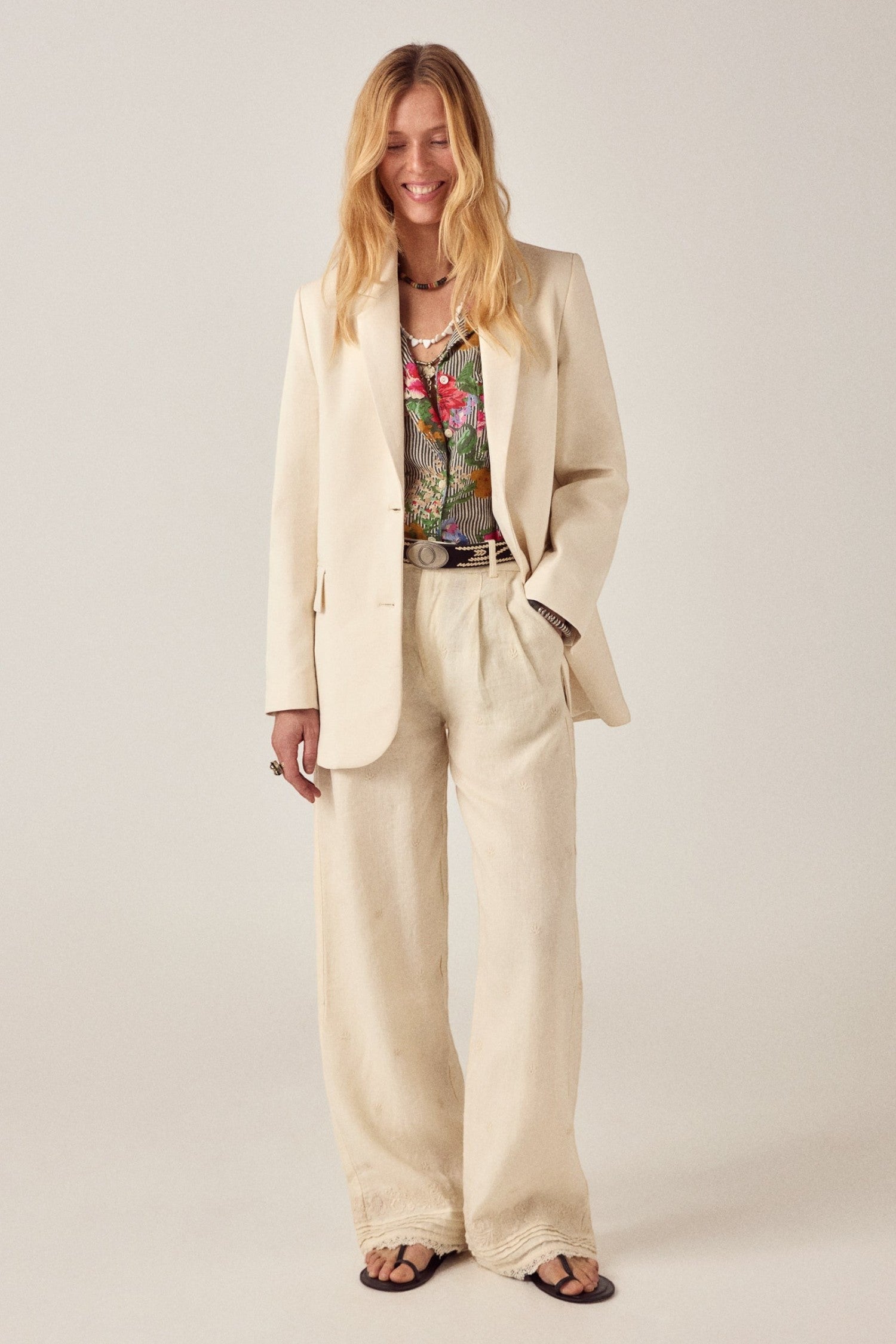 ELSHAM BOUTIQUE Otto Pant in ivory cotton-linen worn by a model with a matching blazer and floral shirt