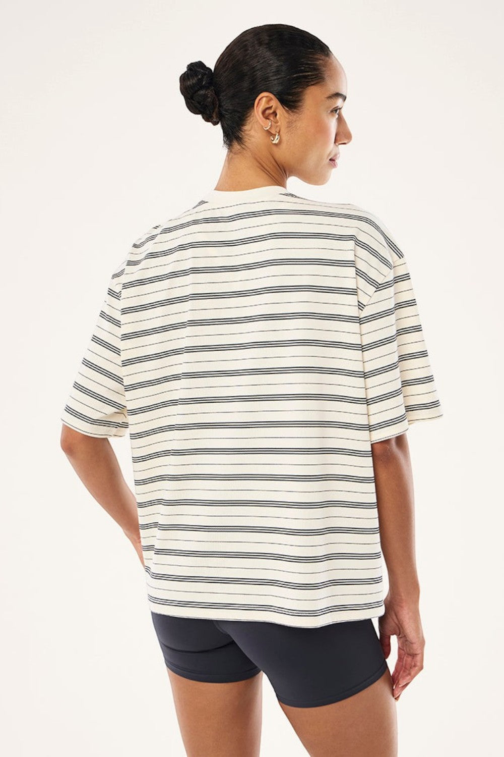 ELSHAM BOUTIQUE oversized whisper white striped tee with short sleeves worn by a woman, back view