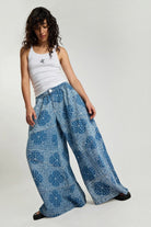 ELSHAM BOUTIQUE Daddios low waist super wide leg cotton jeans in Aegean paisley blue with asymmetrical front seams.