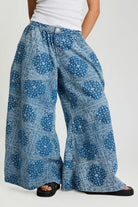 ELSHAM BOUTIQUE Daddios low waist super wide leg denim jeans in Aegean paisley blue with asymmetrical front seams.