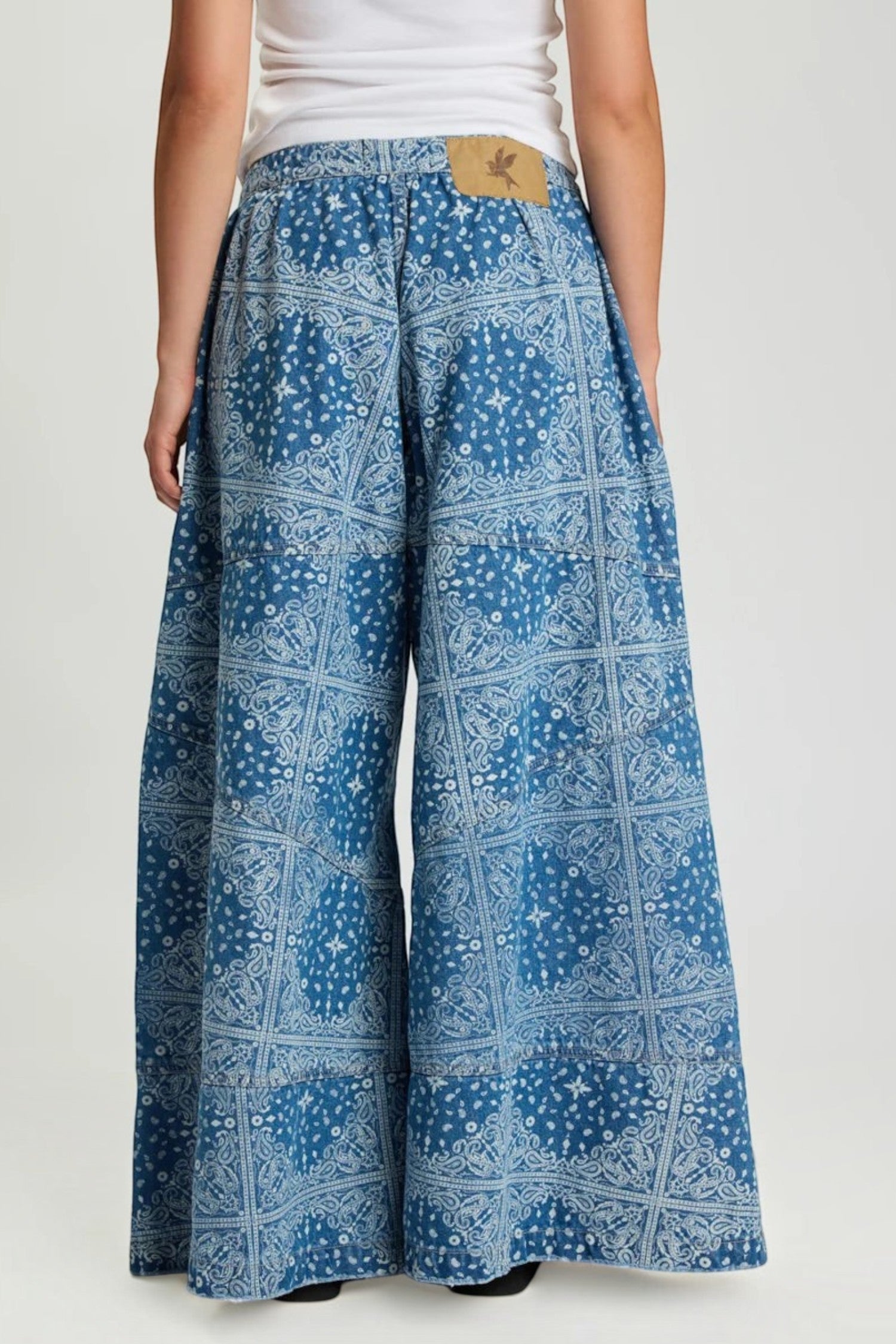 Back view of ELSHAM BOUTIQUE Daddios low waist super wide leg denim jeans in Aegean paisley blue cotton print