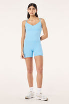 ELSHAM BOUTIQUE Paramount Tank in Alaskan Blue with scoop neck and double back straps worn with matching active shorts