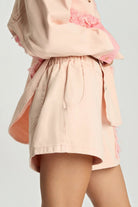 ELSHAM BOUTIQUE pink petal high waist flippy denim shorts with elasticated waistband and frayed hem detail