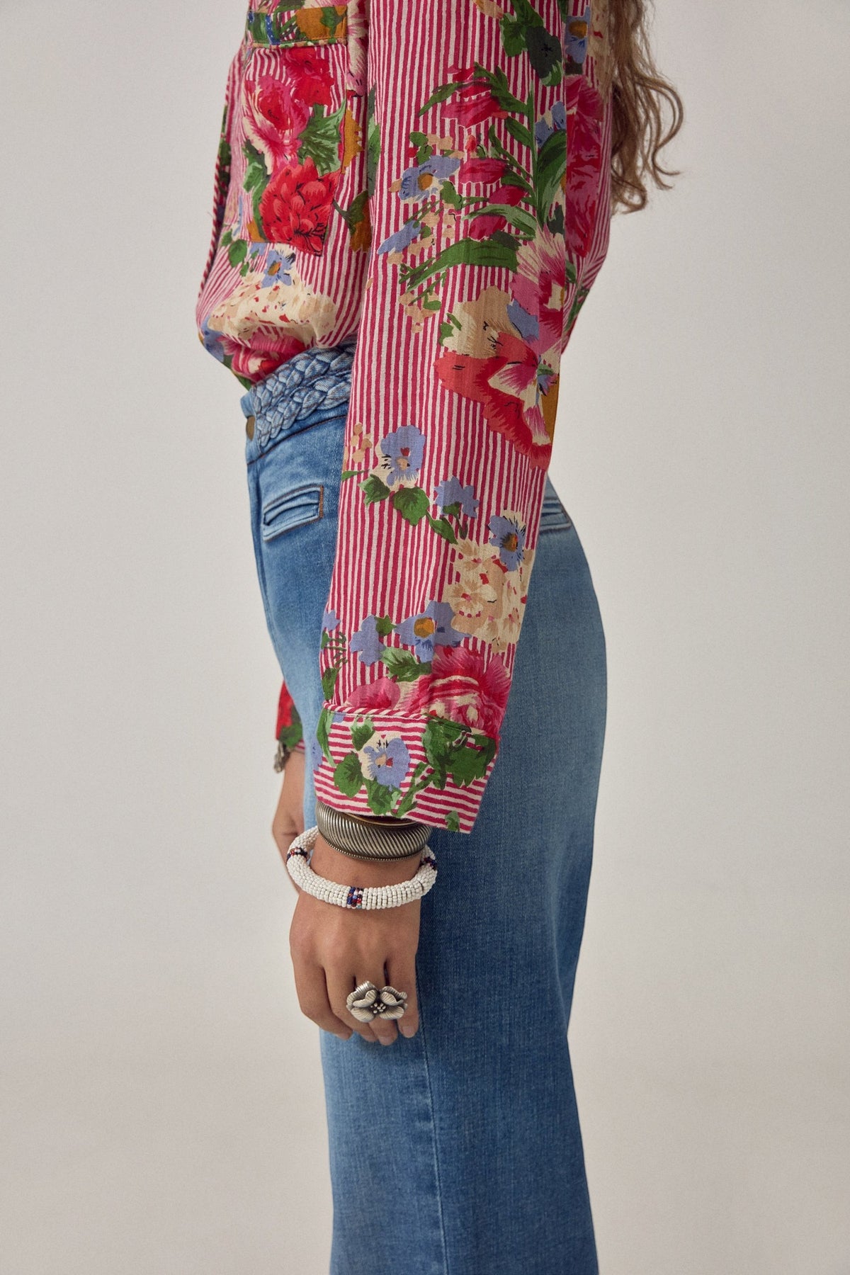 ELSHAM BOUTIQUE Piti shirt in rouge featuring a bold floral print over fine stripes, crafted from soft cotton.