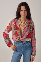 ELSHAM BOUTIQUE Piti shirt in rouge cotton with bold floral print and fine stripes, worn with blue denim jeans