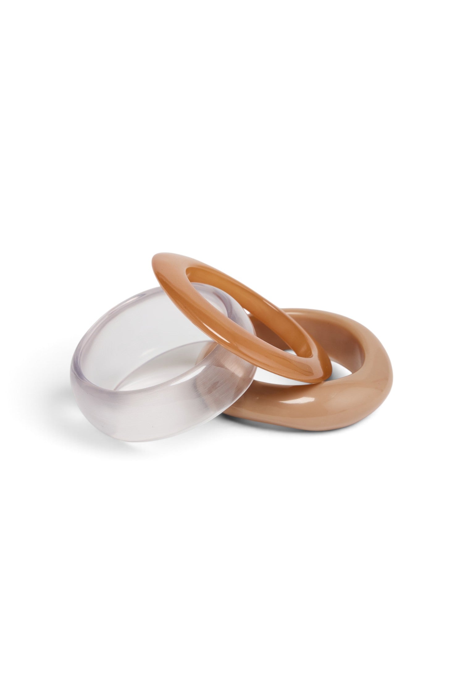 ELSHAM BOUTIQUE Serenity set of three resin bangles in clear, tan, and beige neutral tones.