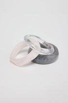 ELSHAM BOUTIQUE Aqua Life bangle set featuring three resin bracelets in translucent, marbled grey, and pale pink.